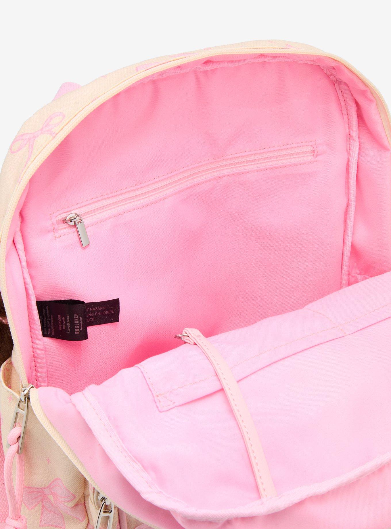 Mochila mini con lazos rosados y bolsillo transparente