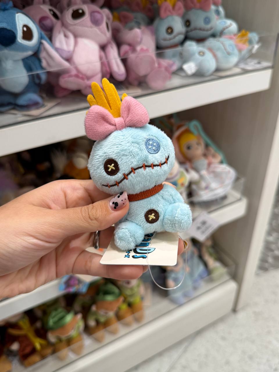 Peluche Criatura Azul con Lazo Rosado