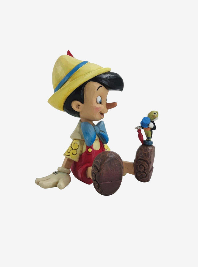 Figura de Pinocchio y Jiminy Cricket sentados