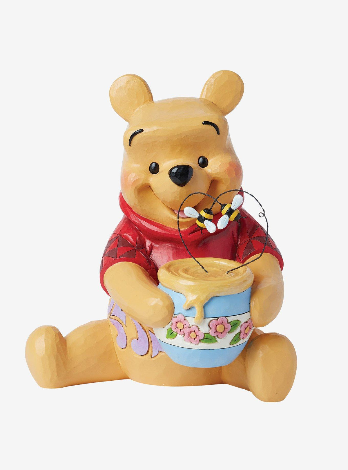 Figura de Winnie the Pooh con tarro de miel