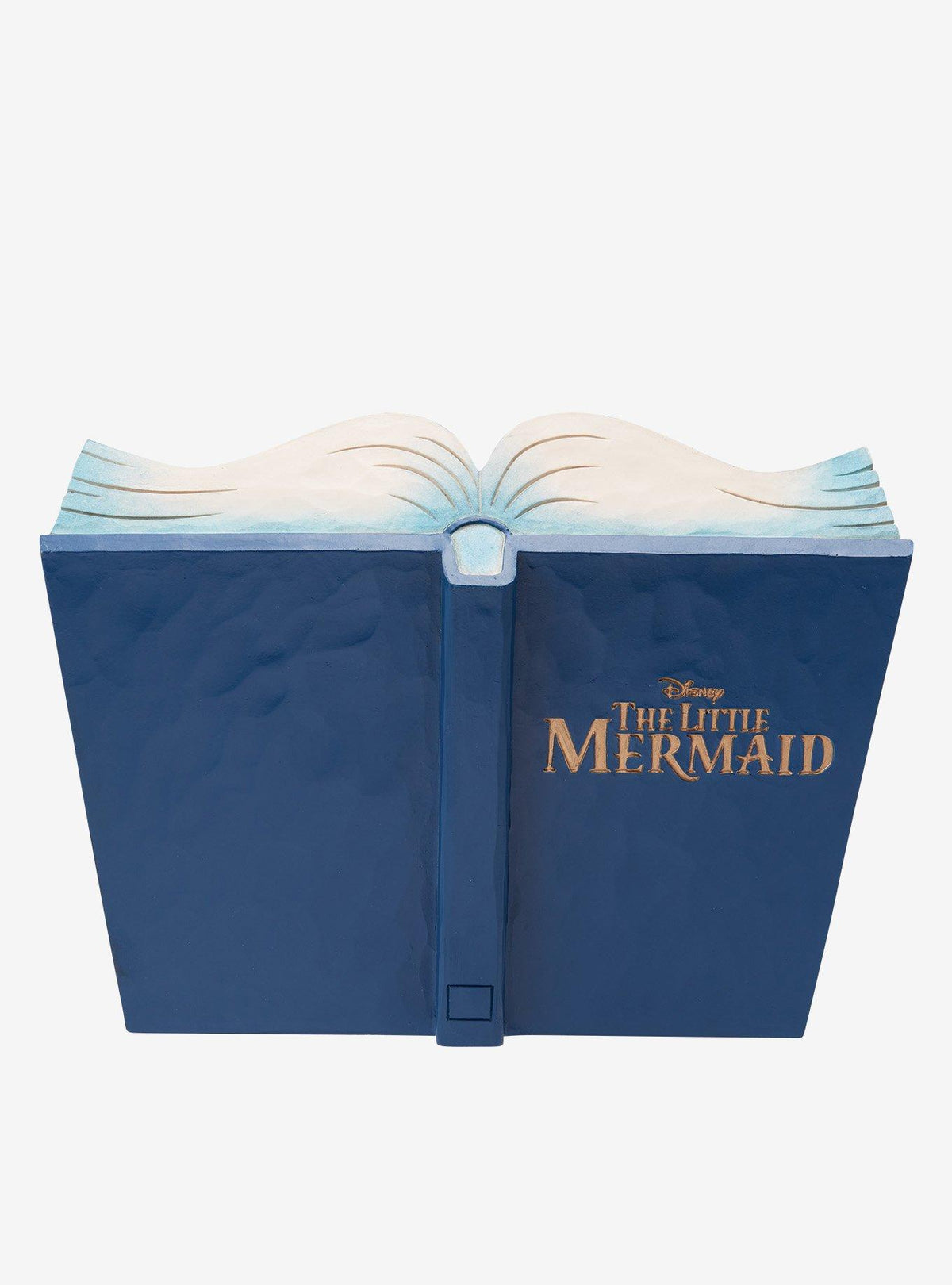 Figura Jim Shore de The Little Mermaid en un libro