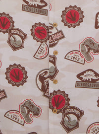 Camisa infantil Jurassic Park con estampado de insignias