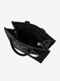 Bolso tote sherpa negro de Snoopy con correa para maleta