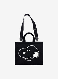 Bolso tote sherpa negro de Snoopy con correa para maleta