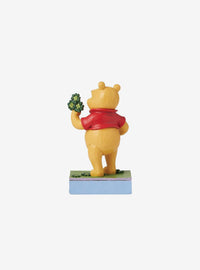 Figura de Winnie the Pooh con tréboles y caldero