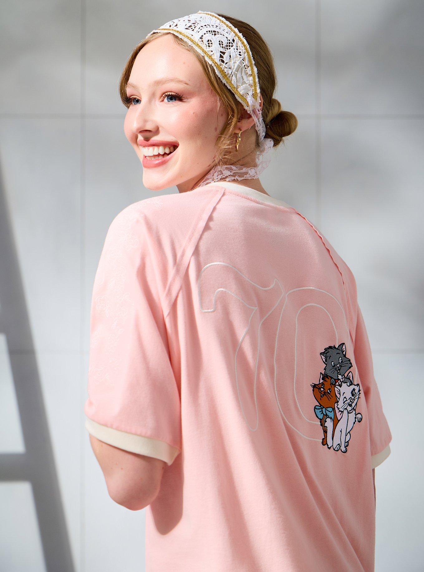 Polera rosada con bolsillo The Aristocats para mujer