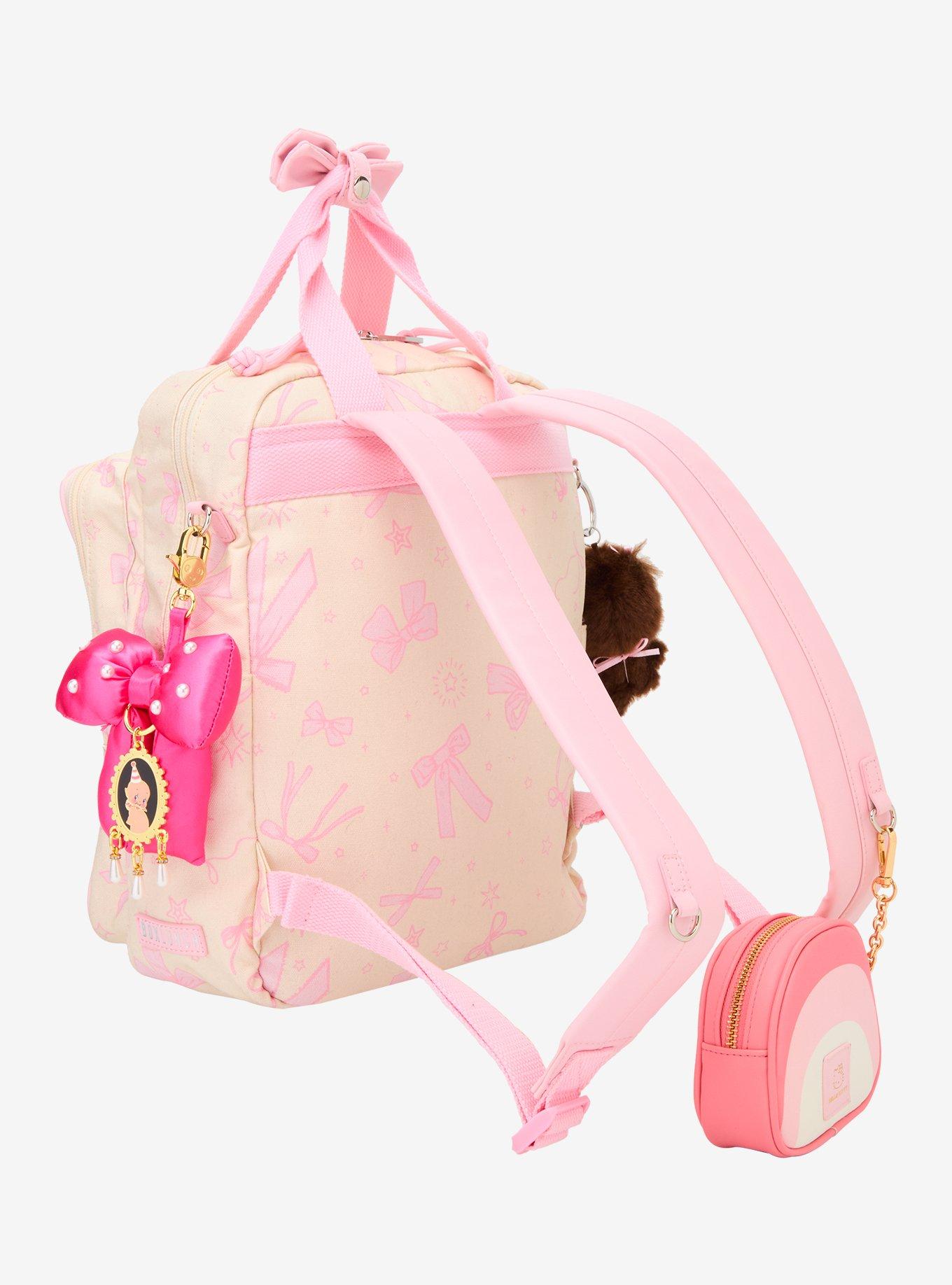 Mochila mini con lazos rosados y bolsillo transparente