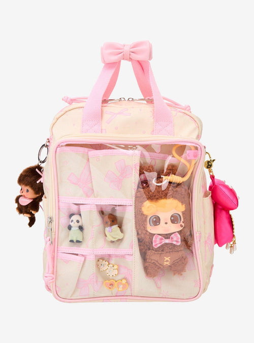 Mochila mini con lazos rosados y bolsillo transparente