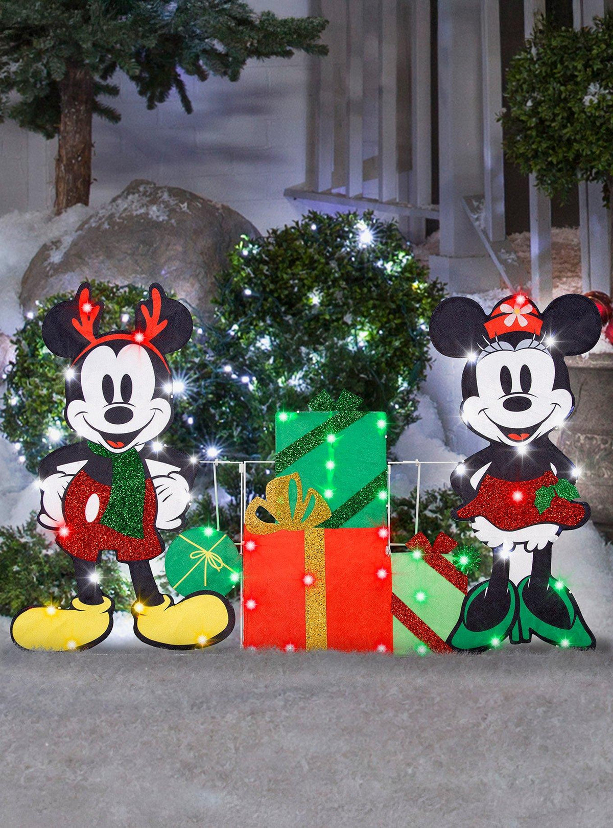 Decoración navideña iluminada de Mickey y Minnie con regalos