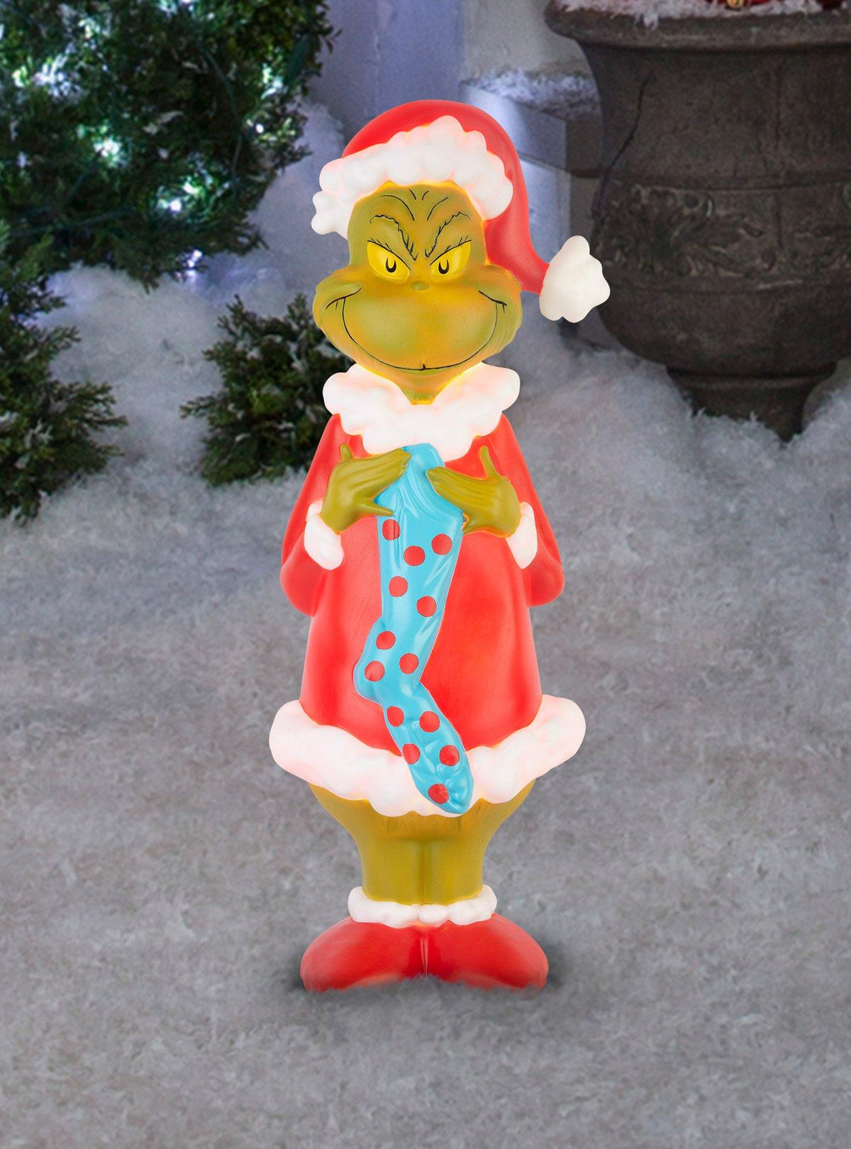 Figura iluminada del Grinch con calcetín navideño