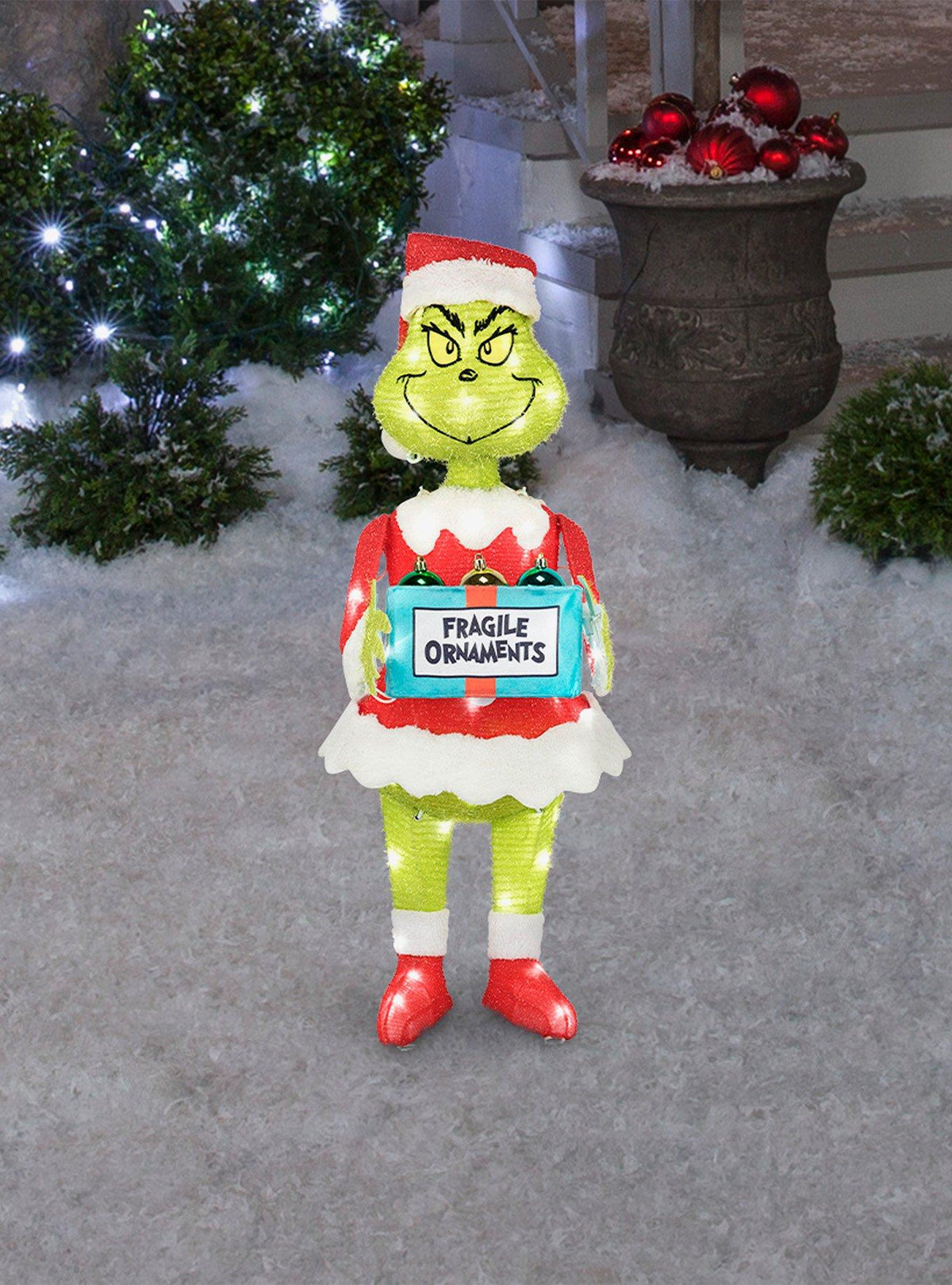 Escultura iluminada del Grinch con caja de adornos