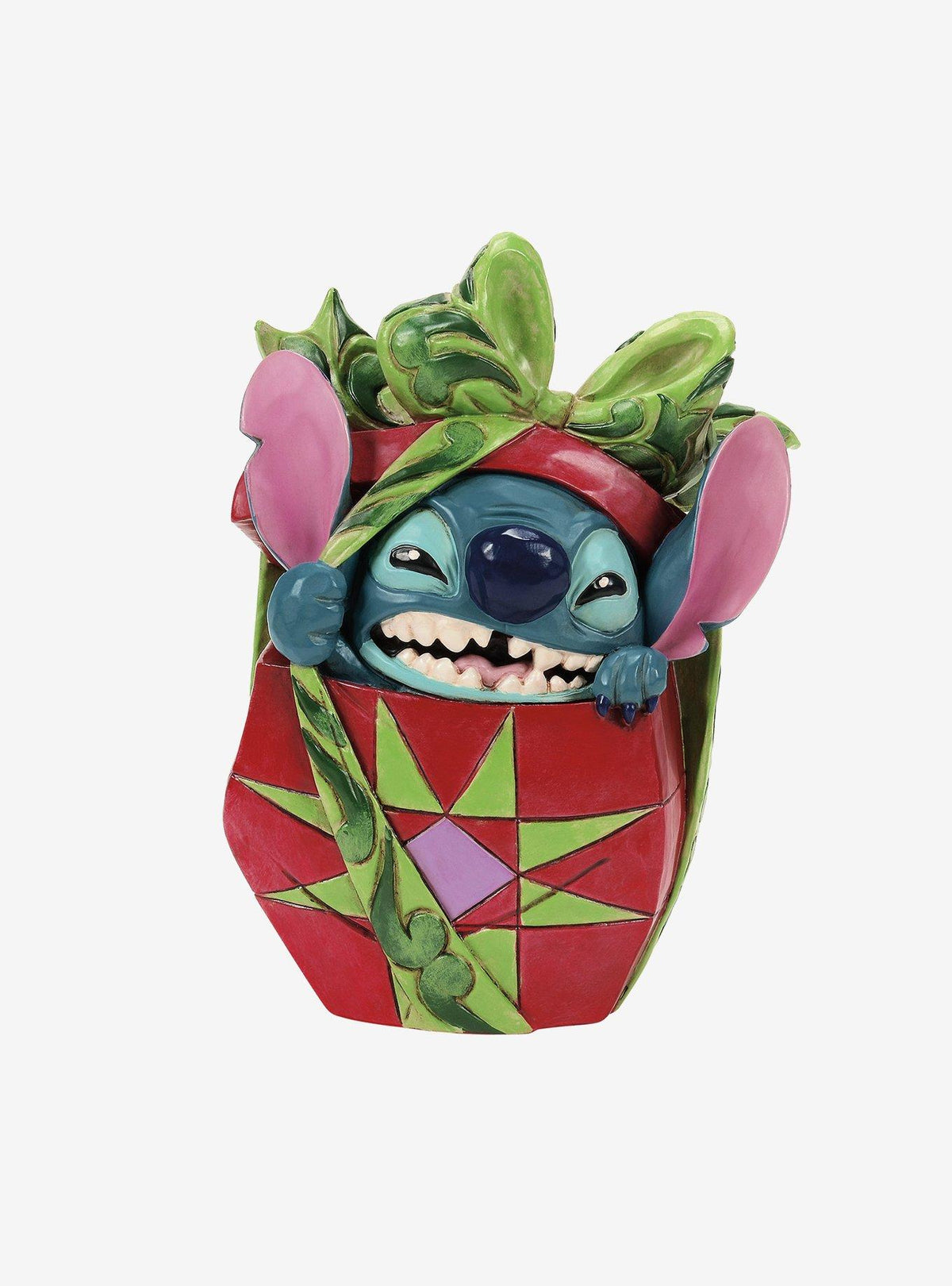 Figura navideña de Stitch rompiendo un regalo