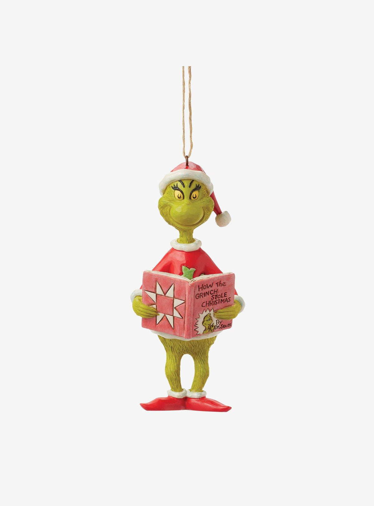Adorno del Grinch leyendo su historia