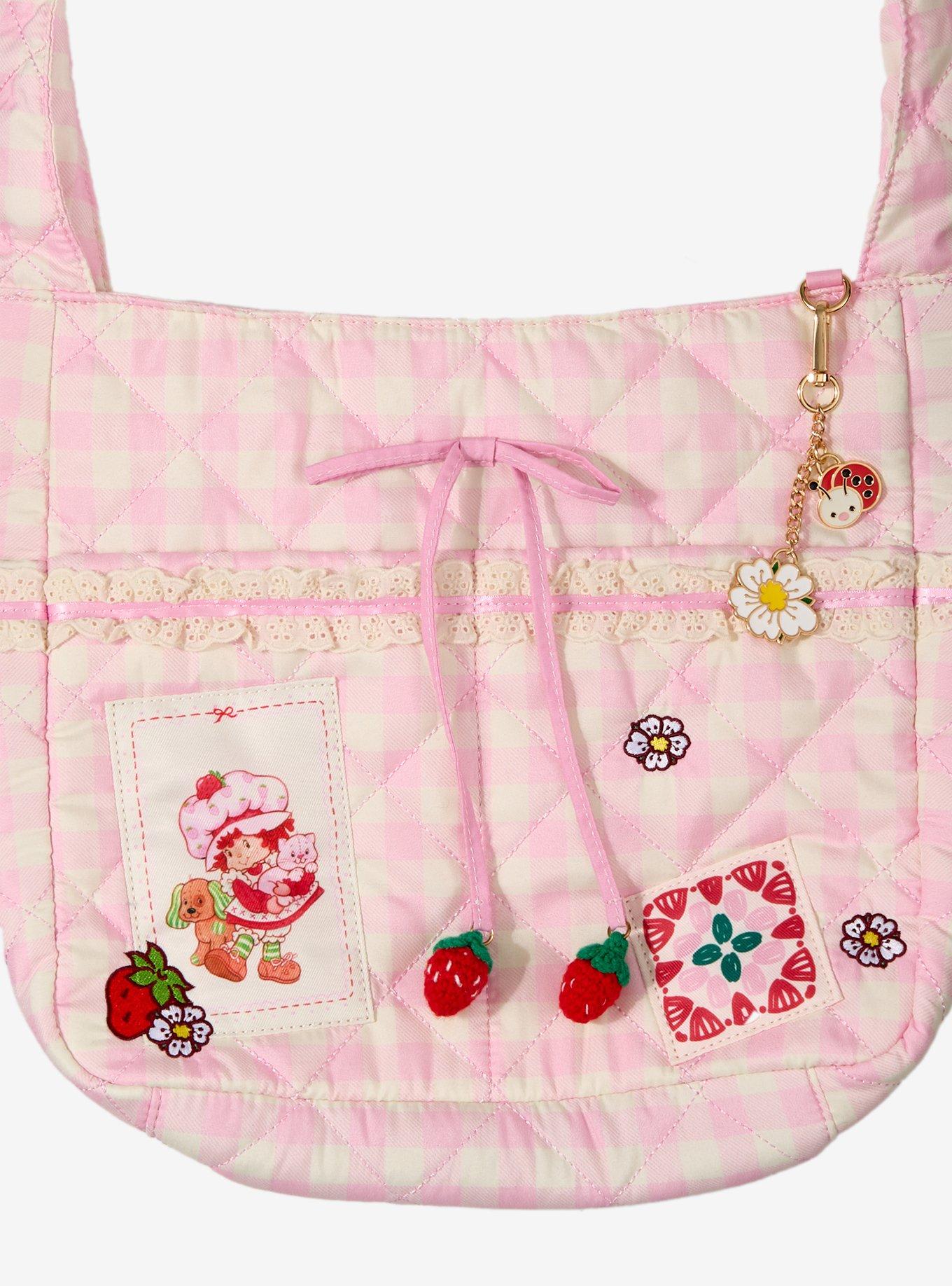 Cartera bandolera rosada de cuadros de Strawberry Shortcake