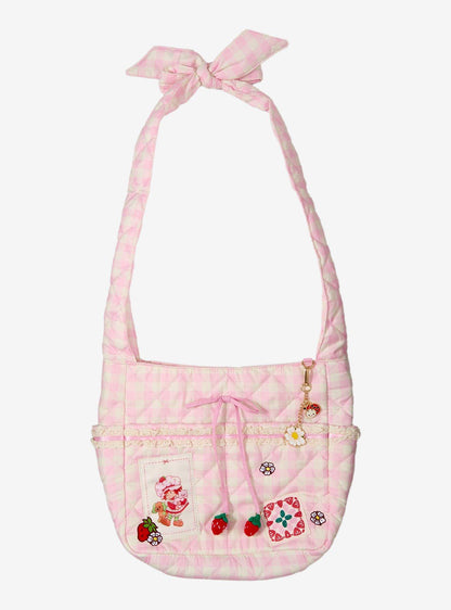 Cartera bandolera rosada de cuadros de Strawberry Shortcake