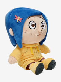 Peluche de Coraline sentada