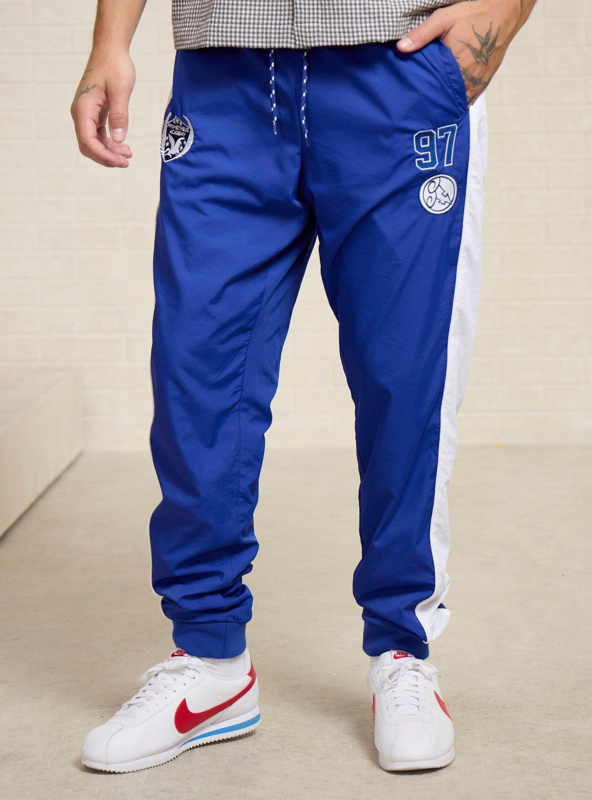 Jogger deportivo con insignias de Hércules Disney