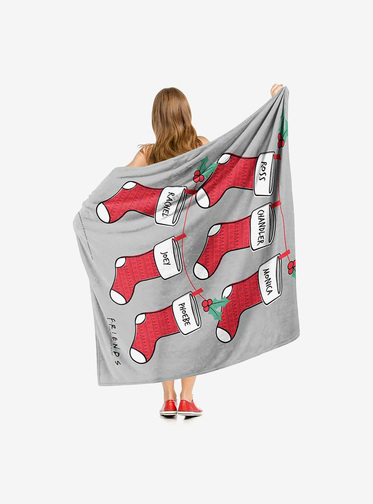 Manta Friends con diseño de medias navideñas