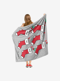 Manta Friends con diseño de medias navideñas