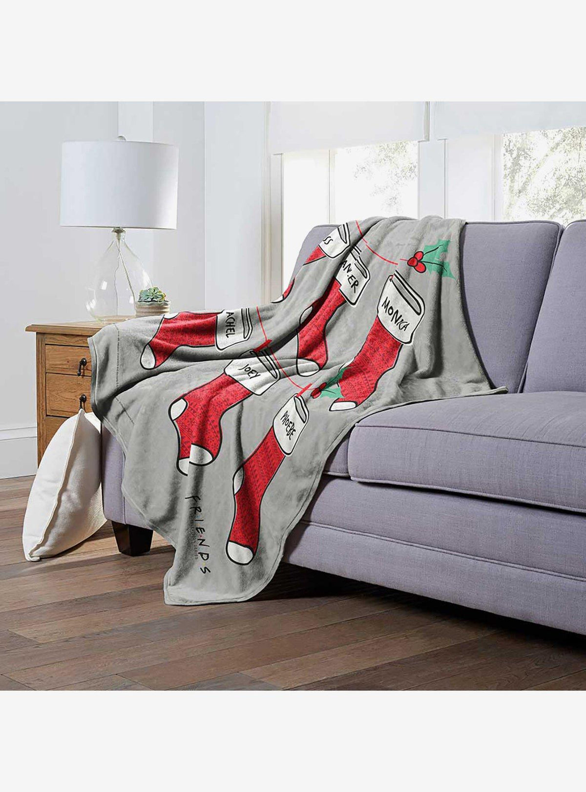 Manta Friends con diseño de medias navideñas