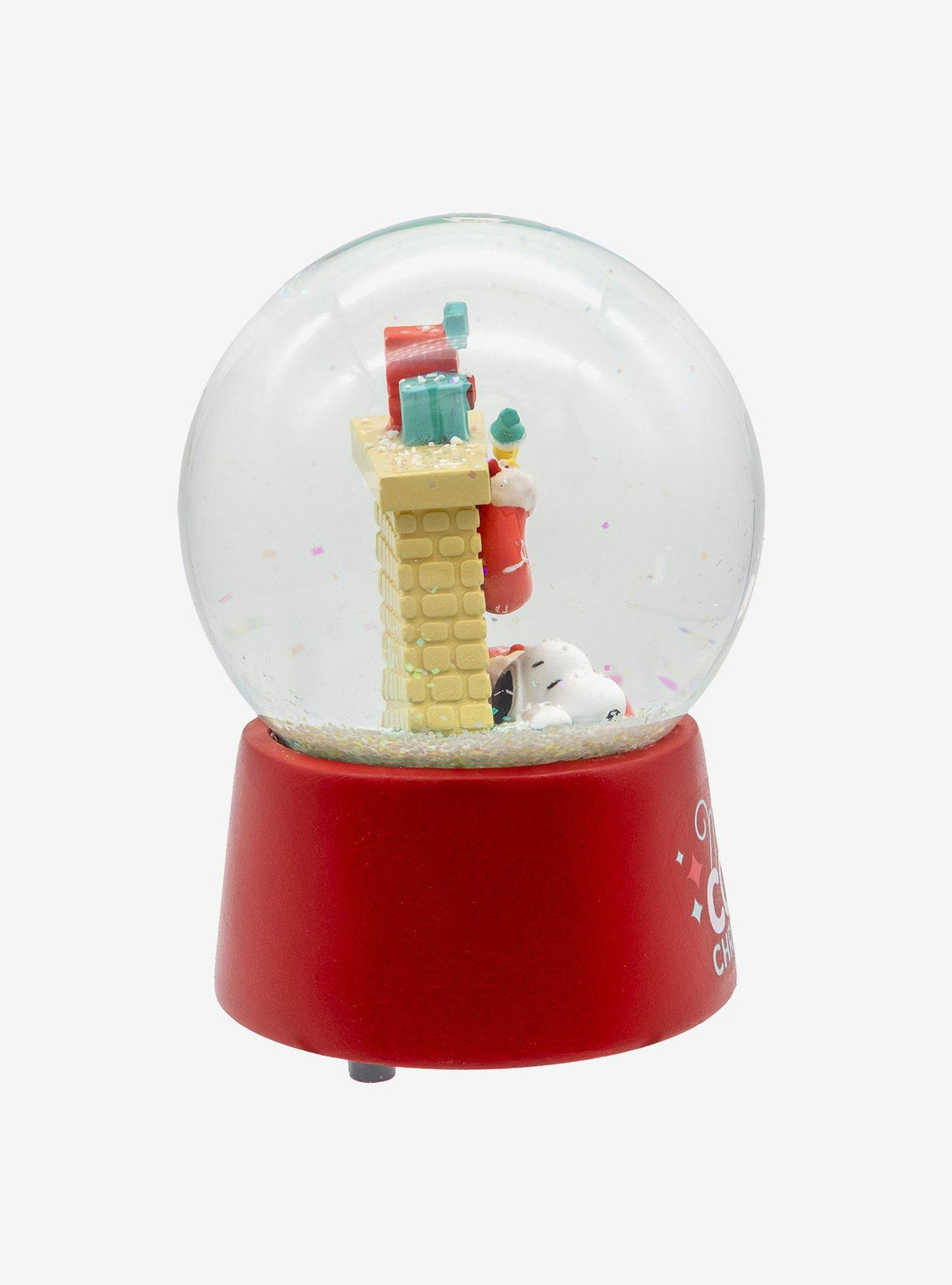 Globo de nieve musical de Snoopy junto a la chimenea
