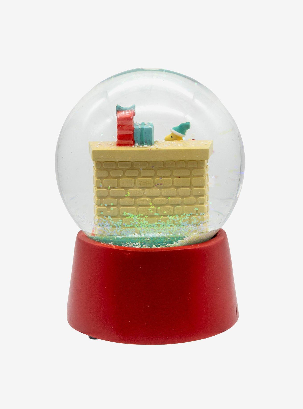 Globo de nieve musical de Snoopy junto a la chimenea