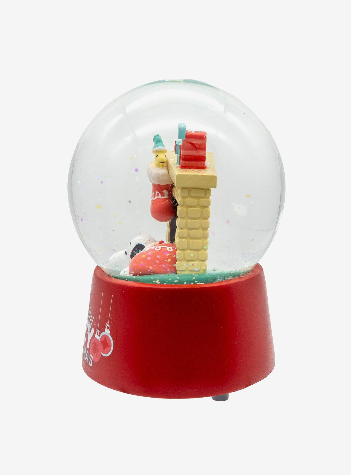 Globo de nieve musical de Snoopy junto a la chimenea