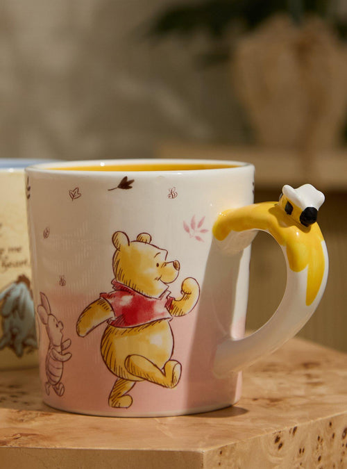 Taza Disney Winnie the Pooh con personajes en boceto