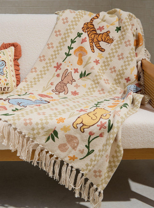 Manta tejida floral clásica de Winnie the Pooh