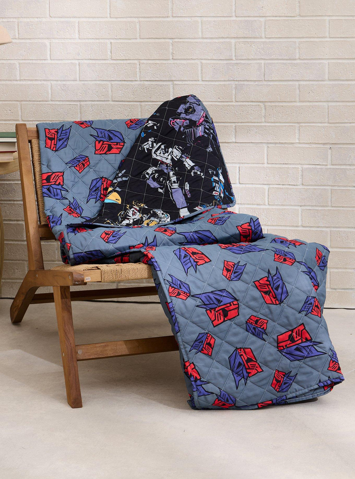 Manta acolchada reversible retro de Transformers