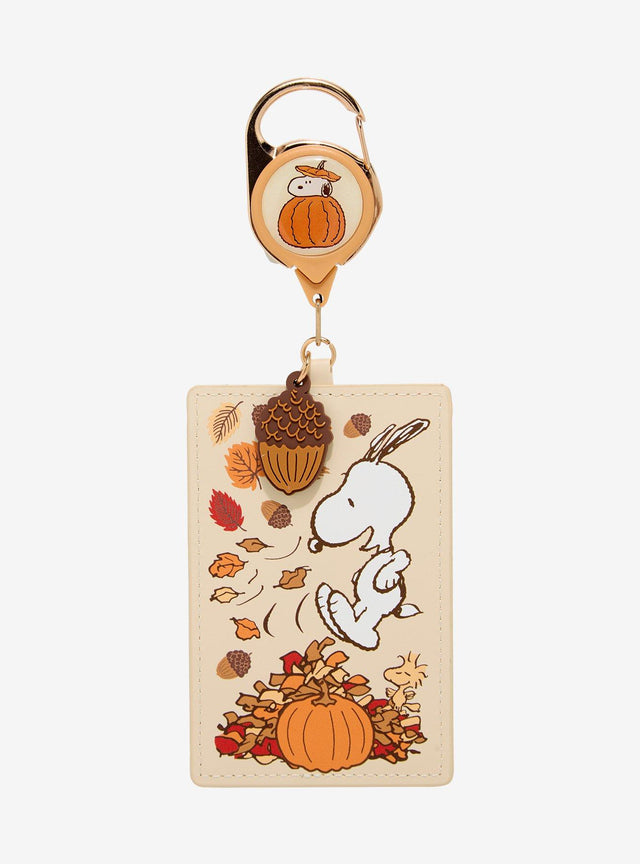 Lanyard retráctil Snoopy entre hojas otoñales