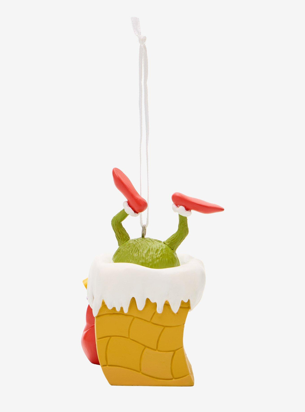 Adorno navideño de El Grinch en una chimenea