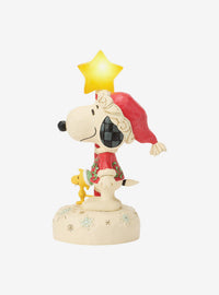 Figura iluminada de Snoopy con bastón de estrella