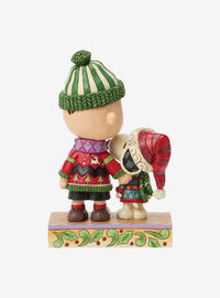 Figura Peanuts: Snoopy y Charlie Brown con suéteres navideños