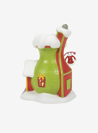 Figura del Grinch en su tienda de trajes de Santy
