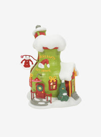 Figura del Grinch en su tienda de trajes de Santy