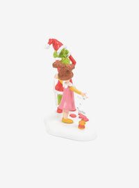 Figura de El Grinch probándose el traje de Santa