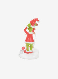 Figura de El Grinch probándose el traje de Santa