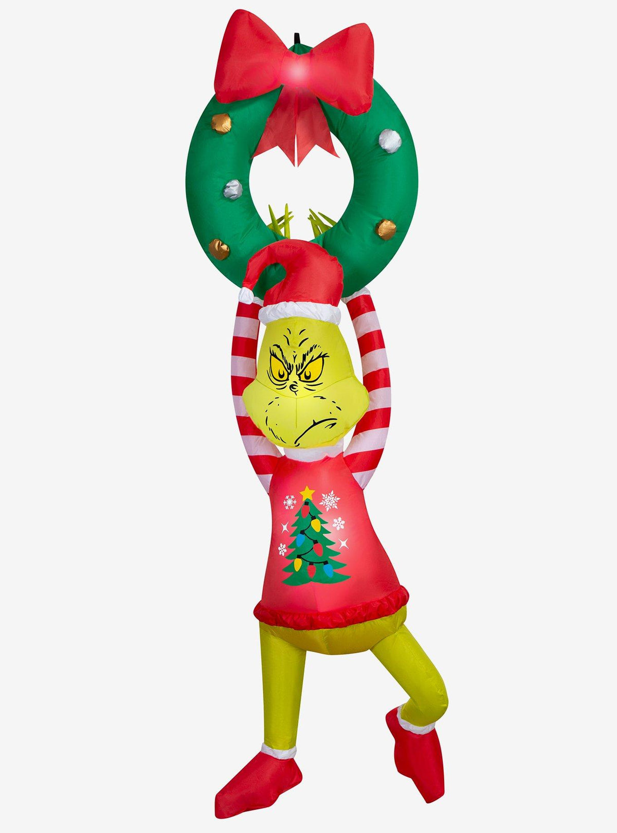 Adorno inflable del Grinch colgando de una corona