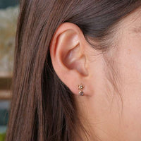 Aros de Jasmine en oro amarillo K10 y topacio