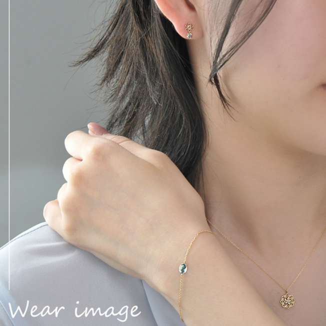 Aros de Jasmine en oro amarillo K10 y topacio