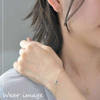 Aros de Jasmine en oro amarillo K10 y topacio