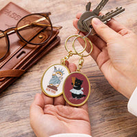 Llavero metálico ovalado Mofusand - Gato Estatua de la Libertad