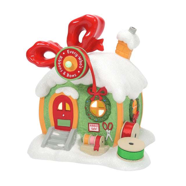 Aldea del Grinch: tienda de cintas y lazos iluminada