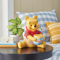 Figura de Winnie the Pooh con tarro de miel