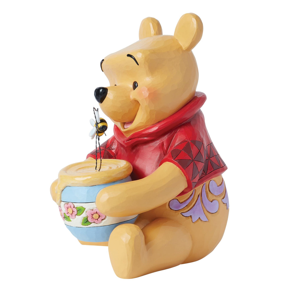 Figura de Winnie the Pooh con tarro de miel