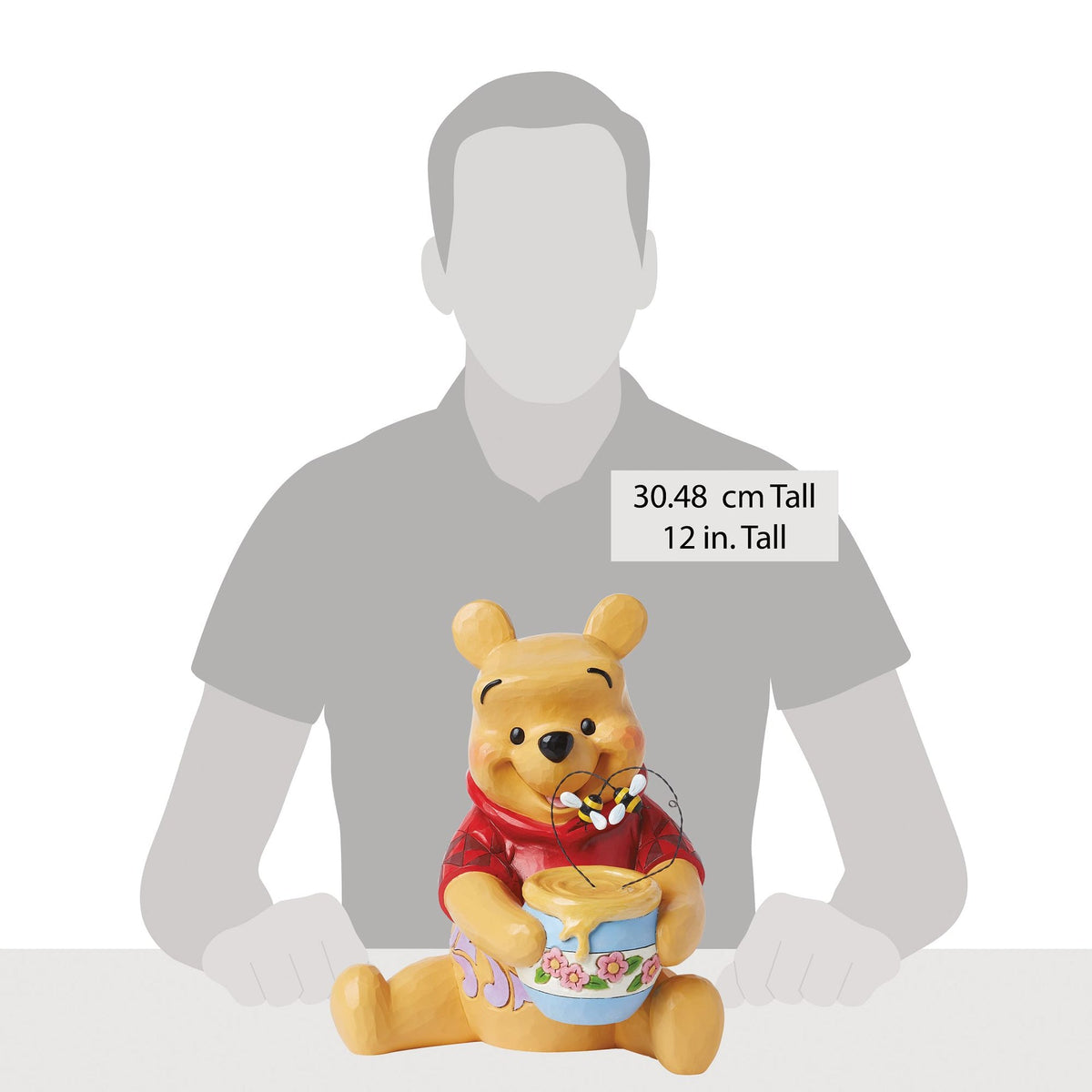 Figura de Winnie the Pooh con tarro de miel