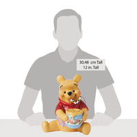 Figura de Winnie the Pooh con tarro de miel
