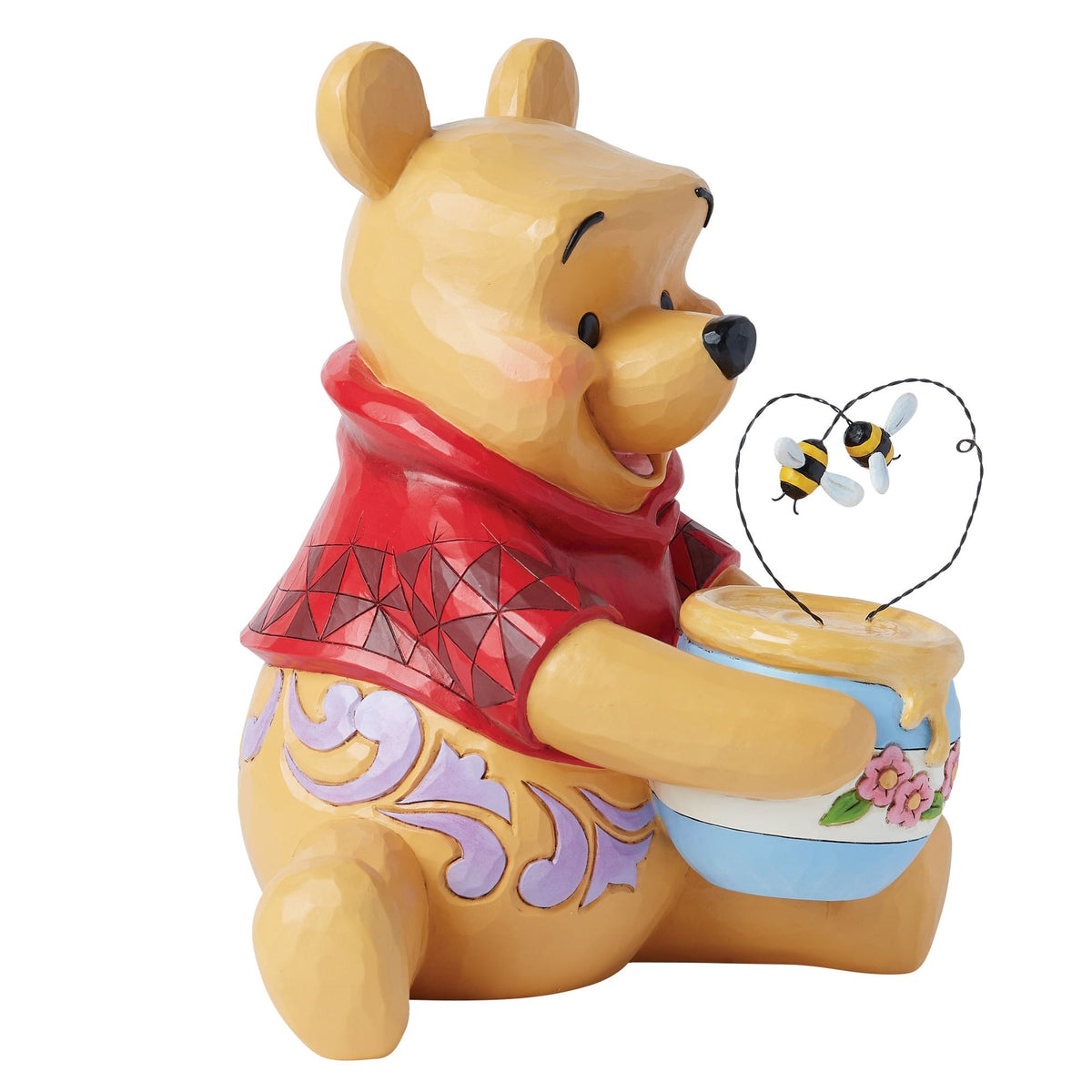 Figura de Winnie the Pooh con tarro de miel