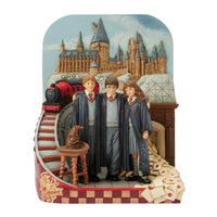 Figura Harry Potter: Trío frente al castillo de Hogwarts